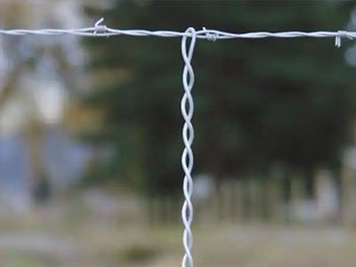 Keep barbed wire lines trim and evenly spaced.